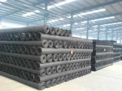Several black color steel plastic composite mine supporting mesh in the warehouse.