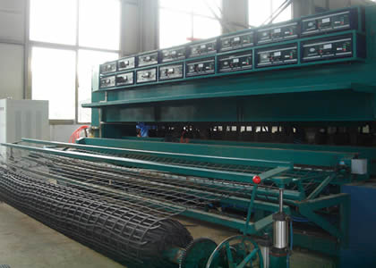 There is a steel plastic geogrid production machine.