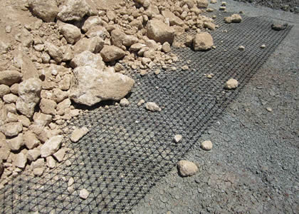A piece of triaxial geogrid under soil.